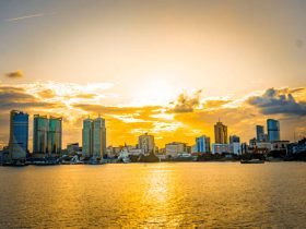 Aerial view of Dar es Salaam's harbor and skyline at sunset.