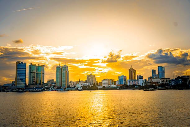 Aerial view of Dar es Salaam's harbor and skyline at sunset.