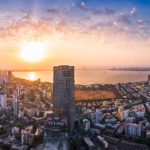 Mumbai skyline at sunset with the Arabian Sea in the foreground