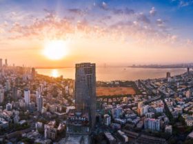 Mumbai skyline at sunset with the Arabian Sea in the foreground