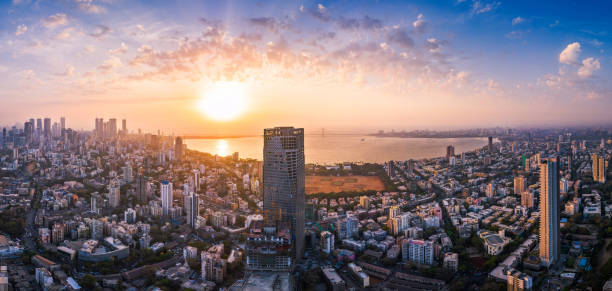 Mumbai skyline at sunset with the Arabian Sea in the foreground