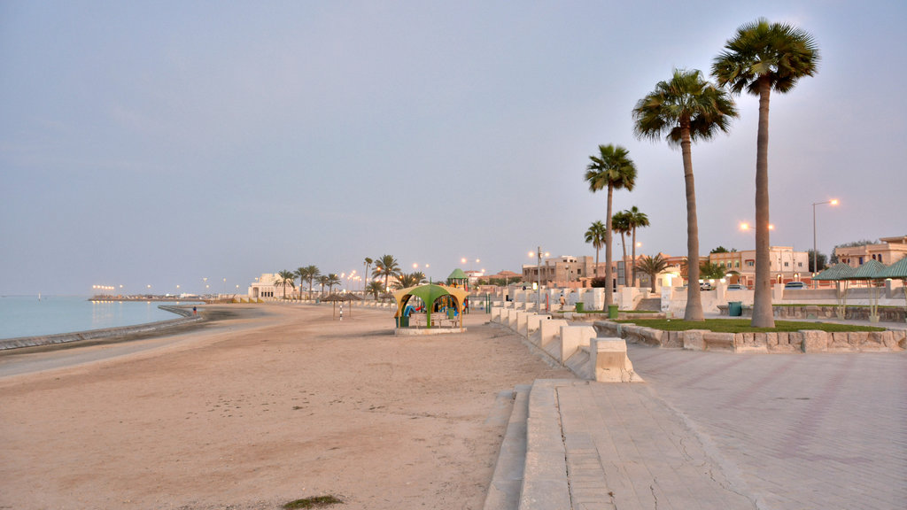 Beautiful coastal view of Al Khor, Qatar, with clear skies, calm waters, and boats near the shore, perfect for a travel blog header.