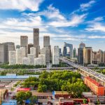 A panoramic view of Beijing's skyline featuring modern skyscrapers and traditional architecture.
