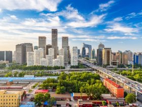 A panoramic view of Beijing's skyline featuring modern skyscrapers and traditional architecture.