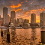 Boston skyline at sunset with reflections on the Charles River