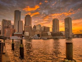 Boston skyline at sunset with reflections on the Charles River
