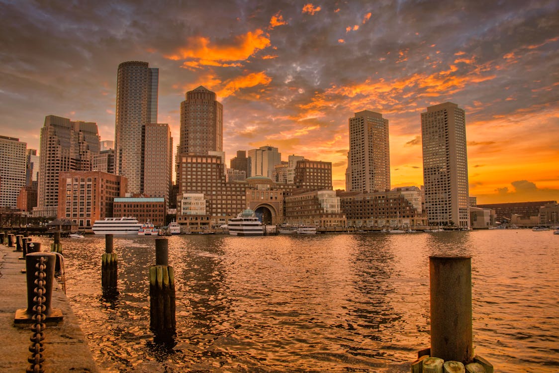 Boston skyline at sunset with reflections on the Charles River