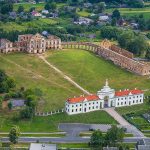 A scenic view of the Yaselda River with Byaroza Monastery ruins in the background, Belarus