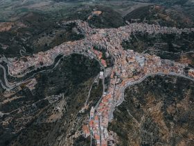 Panoramic view of Centuripe, Sicily, highlighting its distinctive hilltop layout and surrounding landscape.