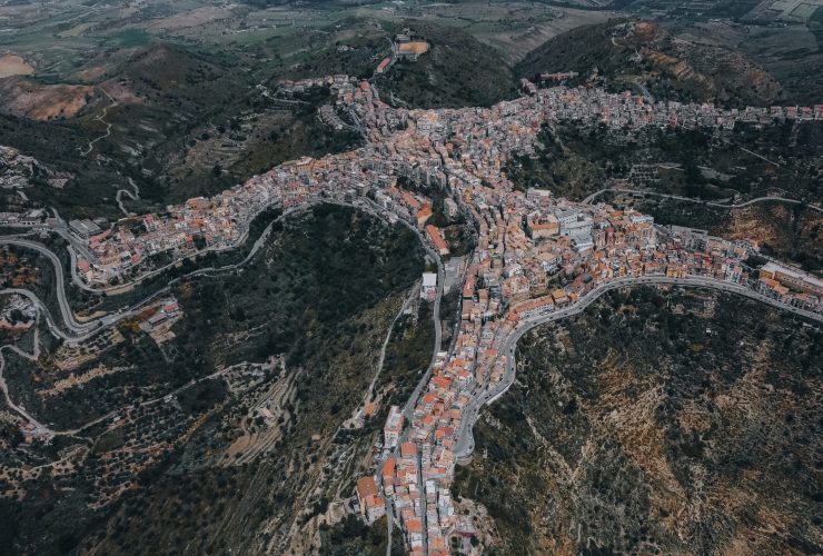 Panoramic view of Centuripe, Sicily, highlighting its distinctive hilltop layout and surrounding landscape.