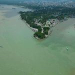 Panoramic view of Chandpur River with boats and cloudy sky