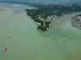 Panoramic view of Chandpur River with boats and cloudy sky