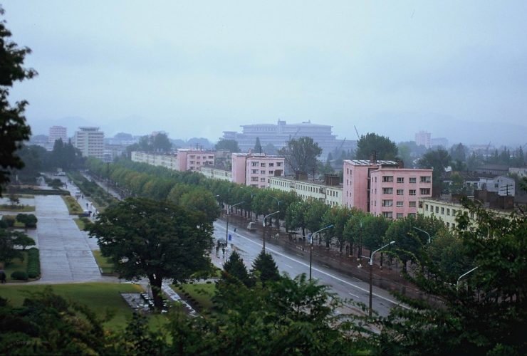 Hamhung cityscape with Mount Kuwol in the background, showcasing North Korea's unique blend of nature and urban life.