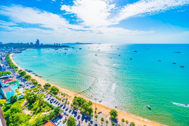 Aerial view of Pattaya city skyline with the beach and turquoise sea under a blue sky